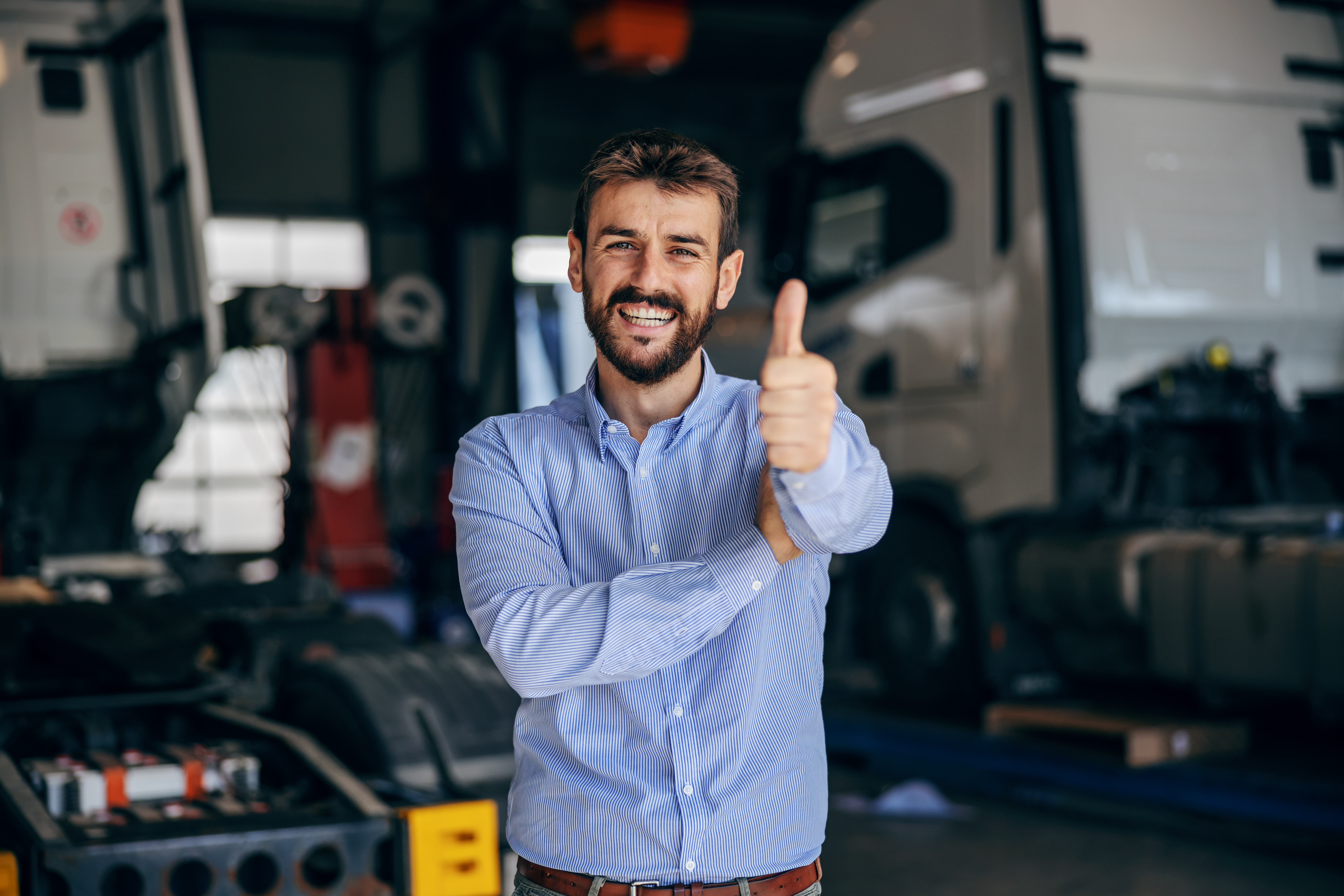 businessman with trucks in the background