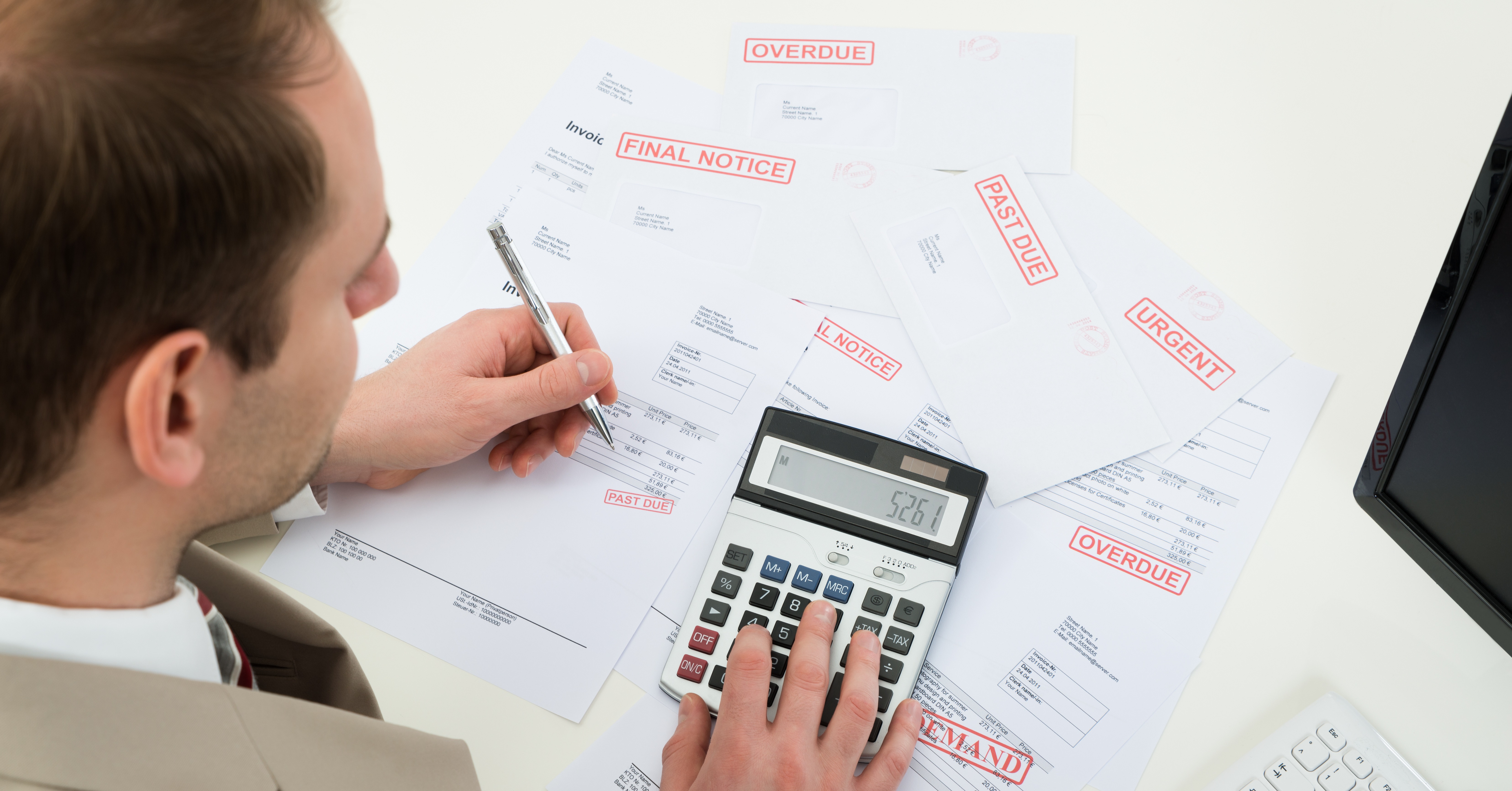 Man looking at unpaid invoices