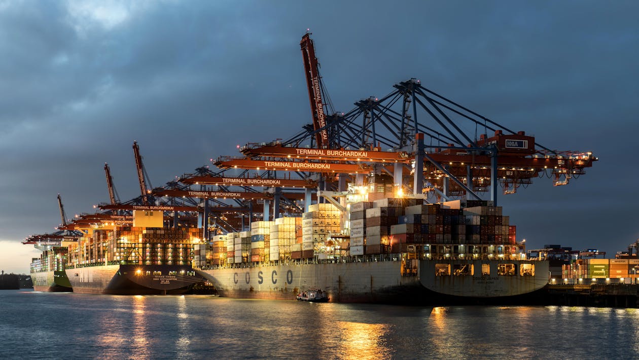 Export factoring is a financial tool that lets businesses sell their overseas invoices to a third party for fast cash, better cash flow, and fewer risks. This service is especially useful for companies that trade internationally and want to avoid payment delays or deal with collection challenges in foreign markets. With export factoring, a business can access working capital quickly, stay protected from credit risk, and focus on growth instead of chasing unpaid debts.  For companies considering export factoring solutions for international trade, the process is straightforward. A business submits its invoices to a factoring company, which then advances a significant portion of the invoice amount and provides services like collections and credit protection. This enables exporters to manage their finances with less worry about nonpayment or slow remittance from overseas buyers. For more on how it works, see this guide on what is export factoring.  Key Takeaways Export factoring helps businesses get paid faster and reduce risks in international trade. The process lets companies sell invoices to a third party for immediate cash. Choosing the right partner and knowing the costs is important for success. Export Factoring Solutions For International Trade Export factoring gives exporters faster access to funds and helps them handle the risks that come with international trade. Using this financial tool allows businesses to better predict cash flow and protect themselves from foreign buyer non-payment.  How Export Factoring Enhances Cross-Border Transactions Export factoring is used by companies selling goods or services outside their country to get paid quickly without waiting for buyers to settle invoices. This is especially useful in international trade, where payment delays are common and buyers may be in countries with different laws and regulations.  With export factoring, a financial institution buys the business’s receivables and gives them most of the money upfront. This improves cash flow and lets exporters cover operating expenses while waiting for customers to pay. In addition, most export factoring solutions in international trade include credit checks and bad debt protection. This reduces risks tied to unfamiliar buyers.  There are two main types: recourse factoring (the business is responsible if the buyer does not pay) and non-recourse factoring (the factor takes on more of the payment risk). Export factoring often uses non-recourse arrangements for higher protection.  Key Differences From Domestic Factoring Unlike domestic factoring, export factoring deals with risks like foreign exchange rates, different legal systems, and the creditworthiness of buyers in other countries. These extra challenges usually mean exporters need more comprehensive services than domestic sellers.  Export factoring services often include credit protection, collections in the buyer’s country, and handling currency issues. Domestic factoring may not need these added steps, as both seller and buyer are under the same legal system. For more details on these extra services, export factoring international trade guide explains the full package exporters receive.  Table: Export vs. Domestic Factoring  Feature	Export Factoring	Domestic Factoring Currency Handling	Yes	No Legal Jurisdictions	Multiple	Single Credit Protection	Included	Sometimes Collections Service	International	Local Export Factoring Process Explained Export factoring allows companies to get paid quickly for the goods they sell overseas. By working with a factor, businesses can improve cash flow, transfer risk, and focus on expanding exports.  Steps Involved In Export Factoring Agreements The process starts when an exporter delivers goods and issues invoices to their foreign buyers. Instead of waiting months for payment, the exporter can enter into a factoring arrangement. The factor buys these accounts receivable, usually paying up to 80-90% of the invoice value upfront.  The factor then manages collections and monitors the credit standing of buyers. If the buyers pay on time, the factor pays the remaining balance to the exporter after deducting fees and interest. This setup helps businesses reduce risk and get faster access to working capital, supporting stable international trading operations.  Typical Documentation And Requirements Export factoring agreements require specific documents to confirm and process transactions. These often include copies of commercial invoices, shipping documents such as bills of lading, and proof the goods have been delivered. In some cases, credit insurance documents on the buyer may also be needed.  Businesses should also provide information about payment terms and buyer details. Factoring companies typically review the financial health of the buyer, not just the exporter, so accurate and up-to-date accounts receivable information helps speed up approvals. More details on how does export factoring work can be found online.  Export Factoring Benefits For Businesses Export factoring gives companies practical ways to get quick cash from international sales and reduces problems connected to customer payment risk. These benefits help businesses maintain steady operations and support growth without waiting long for payments from overseas buyers.  Cash Flow Improvement Strategies Export factoring helps companies quickly turn invoices into usable cash. When a business sells goods overseas, payment can take weeks or months. With export factoring, a financial company advances most of the invoice value right away, so businesses can cover payroll, pay suppliers, or invest in production.  Access to immediate working capital means businesses do not have to borrow money or strain their resources. Improved cash flow leads to fewer cash crunches and greater flexibility when unexpected costs or big opportunities arise.  Reliable liquidity supports ongoing operations and new project funding. Detailed explanations of how invoice factoring improves cash flow are available at export factoring for invoices get convenient funding.  Risk Mitigation For Exporters Exporters face credit risk when selling to foreign customers who may delay or default on payments. Export factoring includes credit protection, as the factor checks buyer reliability and often takes on the risk if the buyer fails to pay.  This shifts the risk away from the exporter and allows businesses to focus on sales rather than debt collection and payment worries. Factors manage collections and monitor customer payment behavior, which makes international transactions safer.  Export factoring is also considered a form of trade finance guide chapter 10 export factoring, protecting businesses from unexpected losses and helping with stable supply chain finance. This protection is especially valuable for companies expanding into new or risky overseas markets.  Key Players In Export Factoring Export factoring involves several main parties, each with specific roles that impact financial stability and manage non-payment risks.  1. Export Business This is the company selling goods or services to customers overseas. The export business receives fast payment for its invoices, which helps improve cash flow and decrease delays in getting paid.  2. Factoring Company A factoring company (also called the factor) purchases export invoices and takes responsibility for credit protection and collecting payments from foreign buyers. They offer services such as credit protection and collection for exporters.  Export businesses benefit by getting most of the invoice value up front, typically within a few days. The factor holds the remaining balance until the buyer pays the invoice in full.  3. Foreign Buyers Foreign buyers are companies or individuals who purchase the exports. They pay the invoice amount to the factoring company according to agreed terms.  Common risks include non-payment by the foreign buyer. Factoring companies help reduce this risk by checking buyer’s credit and often providing a payment guarantee.  Key relationships in export factoring  Role	Main Responsibility Export Business	Sells goods, assigns invoices Factoring Company	Finances invoices, manages risk Foreign Buyer	Purchases goods, pays invoices More details about how these roles interact is covered in Chapter 10-Export Factoring.  Costs Associated With Export Factoring Export factoring allows businesses to access cash quickly but comes with specific fees. These charges can directly affect profit margins and should be carefully reviewed before signing any agreement.  Common Fees And Charges Export factoring involves several main costs:  Factoring fee: This is usually a percentage of the invoice value, typically ranging from 1% to 5%. Factors like invoice amount, buyer risk, and payment period impact the rate. Service charges: Some providers charge extra for managing collections, ledger maintenance, and customer credit checks. Interest costs: If the factoring company advances a high portion of the invoice early, an interest rate may apply until the buyer pays. These expenses can be higher compared to other financing methods, possibly consuming a notable share of the exporter's margin as stated by Export-U. Exporters should read contracts carefully and compare providers for the best deal.  Evaluating Return On Investment The value of export factoring is not only in immediate cash flow but also in risk reduction. Companies should weigh what they pay against what they receive. Factoring services provide credit protection, help with collections, and support growth by freeing up working capital.  To calculate ROI, businesses can compare the total factoring costs to the benefits: faster payments, less risk on overseas buyers, and fewer bad debts. For more details on how export factoring can impact ROI and margins, see benefits and how it works. Using export factoring is best when the speed and safety gained outweigh the fees involved.  Choosing An Export Factoring Partner Picking the right export factoring partner can directly affect cash flow, risk levels, and customer relationships. The right choice protects the business and builds trust with buyers.  Selection Criteria For Reliable Providers When evaluating export factoring partners, businesses must focus on experience in international markets and strength in credit risk analysis. A good provider should offer clear terms, including all fees, advance rates, and repayment timelines. Look for companies with a strong reputation and established processes for collections and dispute resolution.  It is important that the provider can offer tailored solutions. Different markets and industries need unique handling. An effective factoring company should have the resources to handle various currencies, languages, and laws, reducing payment delays. Reliable partners also use the latest technology for tracking invoices and payments, which helps maintain smooth supply chain operations and transparent reporting.  Customer support and communication standards matter, as these services reflect on how buyers are treated. A partner who values professional relationships can boost buyer confidence and help resolve issues quickly.  Questions To Ask Potential Partners What is your experience with export factoring in our target markets? How do you assess the creditworthiness of international buyers? What is the timeline for advances and collections? Can you provide details about your dispute resolution process? Ask for case studies or client references, focusing on situations similar to your business. Clarify if all costs are included in the quoted rates, or if extra fees apply. Discuss how the factor manages late payments or disputes to see if their approach aligns with company policy.  It helps to ask about technology systems. Check if customers have access to online tracking tools for invoices and payments. For further insights into how this process works and more detail on financial product options, review how export factoring works.  Regulatory And Compliance Considerations Export factoring deals with strict legal and regulatory demands. Businesses must address both international and local rules to avoid risks and legal issues.  International Compliance Standards Export factoring requires compliance with several global financial guidelines. Many transactions happen across borders, so businesses must consider anti-money laundering laws, trade finance regulations, and international banking standards. For example, the Financial Action Task Force (FATF) provides rules to prevent illegal money movement. Factoring deals often need to follow customer identification or due diligence policies.  Letters of credit and documentary collections also have their own sets of compliance needs, which can differ based on country or financial institution. Understanding the legal and regulatory considerations in export factoring is important to avoid costly errors and delays in accessing funds.  Some key compliance requirements include:  Know Your Customer (KYC) checks Anti-Money Laundering (AML) policies Record-keeping and transparency Cross-border data security Strict adherence keeps business activities secure and builds trust with international partners.  Legal Requirements Across Jurisdictions Different countries have their own legal frameworks for export factoring, each with specific rules for contracts and enforcement. A factor might need registration or licensing in a foreign market before they can buy receivables. Laws on debt collection, dispute resolution, and currency exchange also affect the terms of factoring agreements.  Exporters need to be aware of issues like how default is handled, whether local courts recognize factoring contracts, and if documentary collections can be enforced. If the factoring process includes foreign accounts receivable, extra care is required to check enforceability and compliance in the buyer's country.  Some countries also limit or regulate the assignment of receivables, impacting how freely factors can operate. Businesses should consult legal experts to ensure documents and practices meet the laws in every region where they trade.  Frequently Asked Questions Export factoring offers companies faster access to funds by advancing payments on overseas receivables. It also reduces some financial risks and allows better focus on core operations.  How does export factoring benefit international trade? Export factoring gives businesses immediate working capital from international sales by turning invoices into cash. This removes typical waiting periods and improves cash flow for operations or investments. It is especially useful for handling long payment terms in cross-border deals, as explained in key advantages of export factoring.  By outsourcing collection tasks, exporters can focus more on growth and less on administrative burdens.  What are the primary types of factoring in global commerce? There are two major types: recourse and non-recourse. With recourse factoring, a business covers losses if buyers fail to pay. In non-recourse factoring, the factor takes on the credit risk. International trade often uses non-recourse for added protection, as discussed in the meaning and types of export factoring.  Each type fits different risk needs and business goals.  Can export factoring mitigate the risk of non-payment in foreign transactions? Yes, non-recourse export factoring protects exporters against the risk of non-payment by the overseas buyer. The factoring company evaluates customer credit and assumes the risk. This is helpful for companies shipping to new or less familiar markets, as highlighted in this guide to export factoring services and advantages.  This improves confidence in cross-border sales.  In what ways does import factoring differ from export factoring? Export factoring benefits sellers by advancing payment for their foreign receivables. Import factoring, on the other hand, focuses on helping buyers manage their payables and supplier relationships. The main difference is which party (buyer or seller) receives the financial support and risk coverage, with more details found at export factoring for invoices.  This distinction allows each side of the transaction to choose a solution that meets their needs.  What role does forfaiting play alongside export factoring in trade finance? Forfaiting and export factoring both help manage export-related risks. While factoring deals with short-term receivables and ongoing sales, forfaiting is used for longer-term, one-off transactions. Forfaiting transfers payment risk for specific trade finance deals, often involving higher-value contracts.  These tools are often combined to suit different types of international transactions.  How does cross border factoring streamline the trade process? Cross border factoring removes delays by speeding up cash flow and handling collections in foreign countries. It also supports better customer relationships by reducing payment disputes and misunderstandings. By partnering with experienced providers, businesses simplify their global operations, similar to what is discussed in common questions about export factoring.  Global factoring networks also improve transaction security and efficiency.